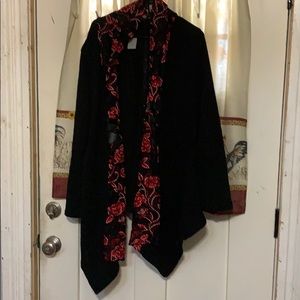 Fun black shrug with red and white floral pattern